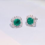 emerald stud earring features a silver setting with gold plating