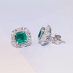 emerald stud earring features a silver setting with gold plating